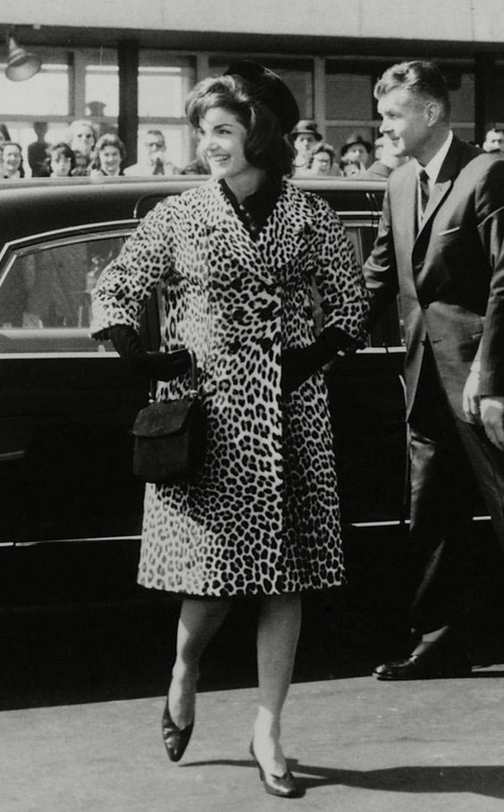 Jackie Kennedy wears a Cassini Leopard skin coat
